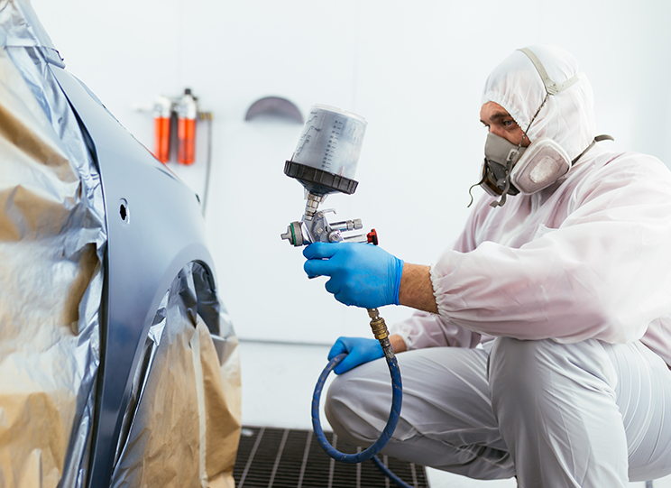Moyer Collision Repair technicians working on a vehicle